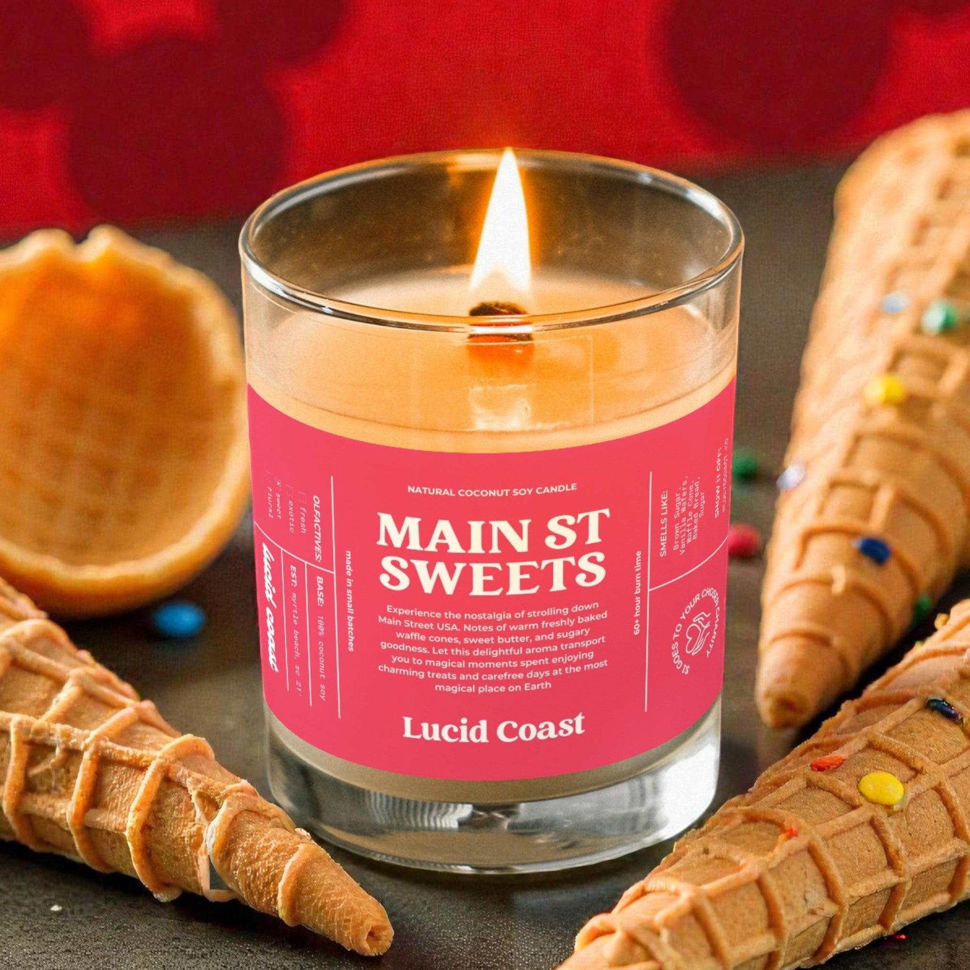 Candle labeled 'Main St Sweets' by Lucid Coast with waffle cones and colorful candies on a red background